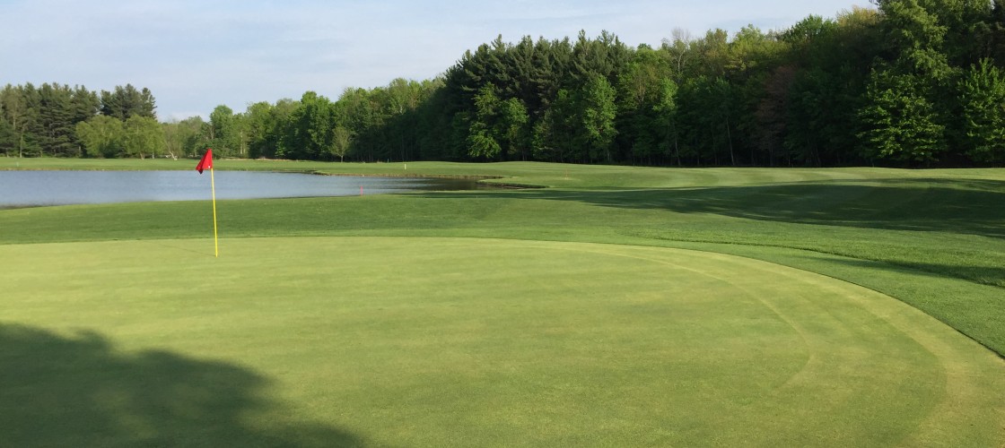 View of a green and water hazard at Churchville.